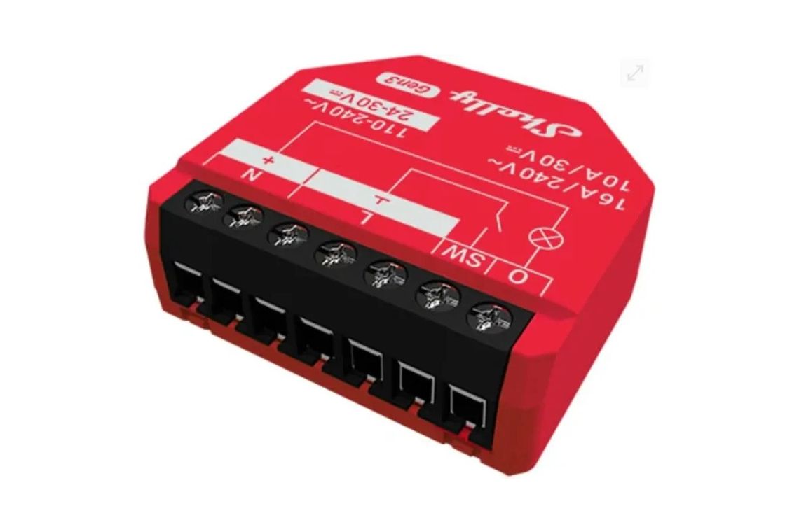 Photo of the Shelly 1PM Gen3, a red module with a row of screw terminals, rated 16 amps at 240 volts