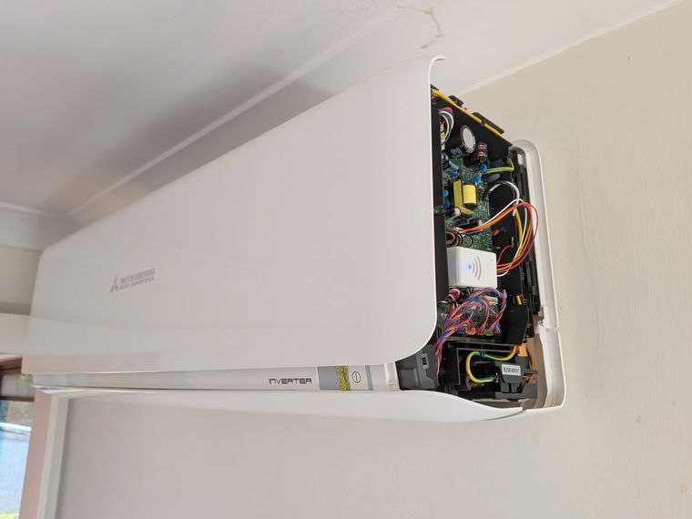EnergyPilot module installed inside a Mitsubishi Heavy Industries inverter air conditioner