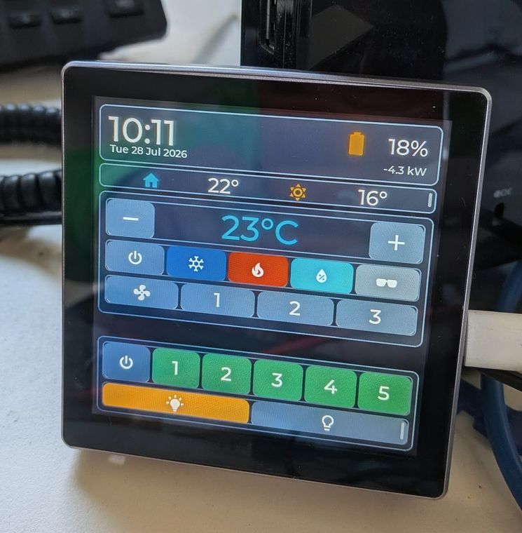 EnergyPilot wall touch-panel showing temperature, aircon modes, fan speeds and lighting controls